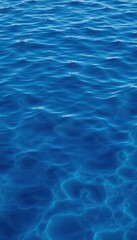 Obraz premium Subtle ripples on a deep blue water surface, creating a textured background, abstract, smooth