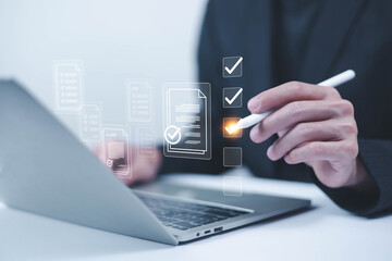 Business performance checklist concept, Businessman using laptop take an assessment,An businessman...