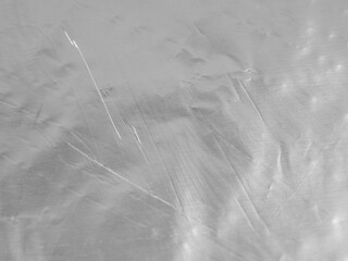 Light plays on crumpled foil.