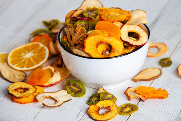 Organic Healthy Assorted Dried Fruit Mix close up. Dried fruit snacks. dried apples, mango, feijoa, dried apricots, prunes top view