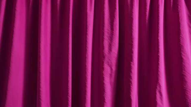 Elegant, textured fuchsia drapery with soft, vertical pleats creating a vibrant backdrop for interior design or fashion concepts.