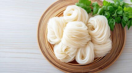 Fresh Rice Noodles on a Bamboo Plate with Green Herbs for Culinary Use and Asian Dishes