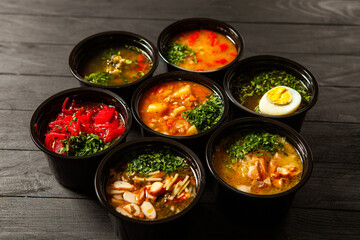 Business lunch in eco plastic container ready for delivery.Top view. Office Lunch boxes with food ready to go. Food takes away. Catering, brakfast.