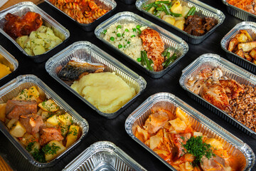 Business lunch in eco plastic container ready for delivery.Top view. Office Lunch boxes with food ready to go. Food takes away. Catering, brakfast.