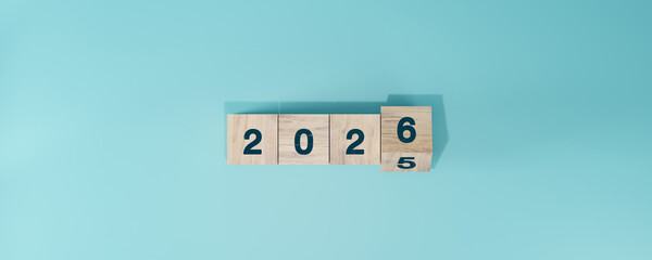 Flipping Wooden cube block for change 2025 to 2026, Countdown to 2026. Loading year from 2025 to 2026. New year start concept.