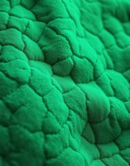 Intricate texture of emerald green felt, subtly uneven surface, background texture, design, backdrop