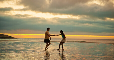 Fototapeta premium Couple, holding hands and playful fun on beach of travel date, sunset and bonding of summer holiday. People, walk and romance for vacation trip, tropical island and relationship commitment of getaway
