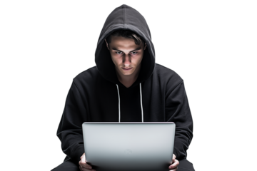 Man in hoodie using laptop against black backdrop with focused and intense expression on his face  on transparent background png