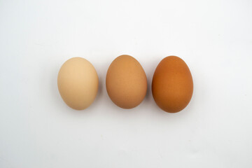 Top view of fresh chicken eggs in paper box package isolated on white background included clipping path. 