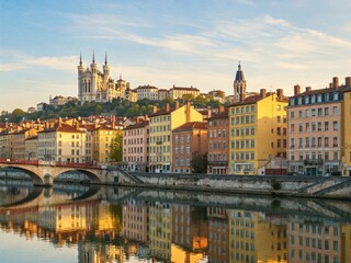 Obraz premium Lyon, France's vibrant cityscape reflects in the Sa?ne River.