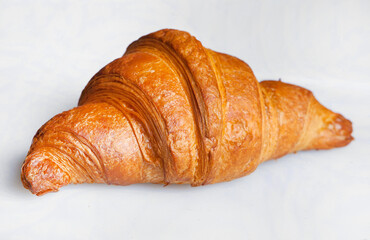Croissant sandwiche with salmon and green parsley. Croissants with red fish on wooden cutting...