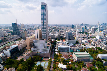 Naklejka premium Aerial View of a Vibrant Urban Cityscape with Modern Skyscrapers and Buildings..