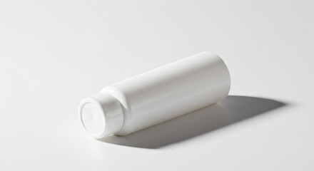 Fototapeta premium White horizontal cosmetic bottle lying on surface