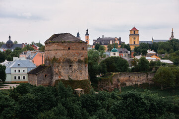 Obraz premium Historic Town View With Ancient Tower and Residential Buildings..