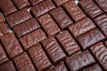 Assortment of sweet confectionery with chocolate candies and pralines. Children's holiday table with chocolate sweets