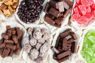 Assortment of sweet confectionery with chocolate candies and pralines. Children's holiday table with chocolate sweets