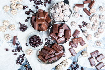 Assortment of sweet confectionery with chocolate candies and pralines. Children's holiday table with chocolate sweets