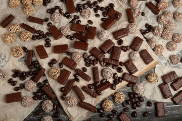 Assortment of sweet confectionery with chocolate candies and pralines. Children's holiday table with chocolate sweets