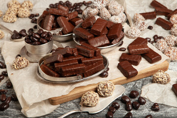 Assortment of sweet confectionery with chocolate candies and pralines. Children's holiday table with chocolate sweets