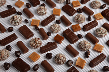 Assortment of sweet confectionery with chocolate candies and pralines. Children's holiday table with chocolate sweets