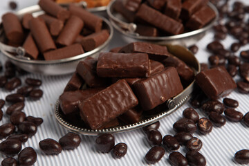 Assortment of sweet confectionery with chocolate candies and pralines. Children's holiday table with chocolate sweets