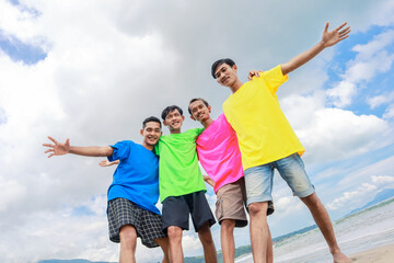Joyful Friends Embrace On Sunny Beach