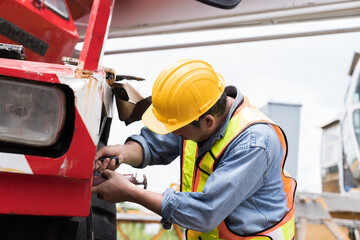 Fototapeta premium Man, Mechanic, Engineer, Construction site. Mechanic repair and maintenance car of truck at auto car repair service. Truck under maintenance