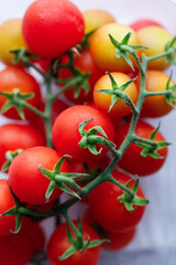 Fresh red cherry tomato on white background.