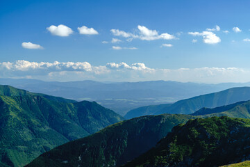 Verdant Tatra Slopes: Clouds and Summits Time Condensed