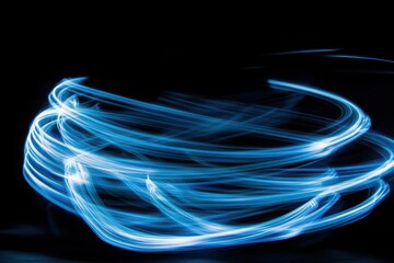 Abstract Blue Light Trails Swirling in Dark Background