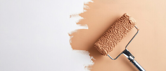 Brown painted wall with paint roller and hand, making of painting a cement wall in brown color