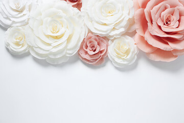 Beautiful paper flowers on white background, flat lay. Space for text