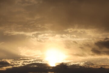 Picturesque view of beautiful sky with setting sun and clouds