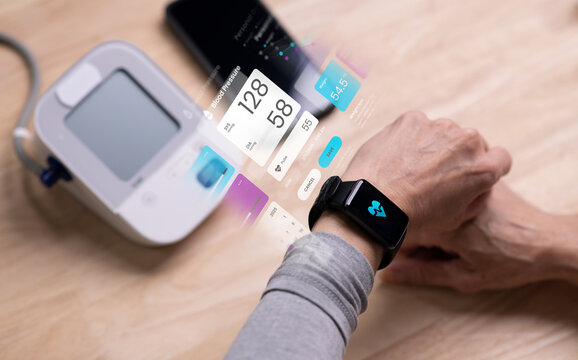 Senior Asian Woman taking blood pressure test on smartwatches, in concept of Augmented reality, Application Interface design, UX UI design, and Health care