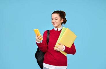 A student girl is looking at her phone.