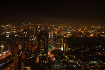 Fototapeta premium Vibrant Night City Skyline Aerial View