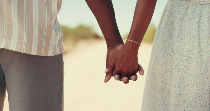 Holding hands, love and couple in countryside for connection, bonding or commitment at honeymoon. Travel, romantic and closeup of man with woman for trust, support or relationship on weekend trip.