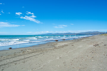 Serene Beach with Gentle Waves and Clear Sky