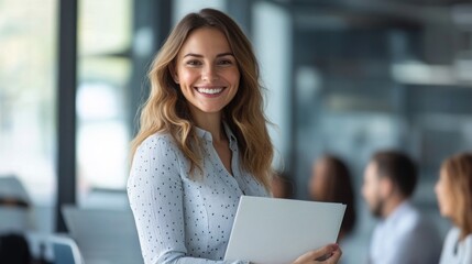 Young professional woman smiling confidently in a modern office setting during a business meeting