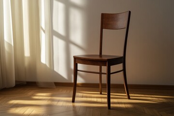 Simple wooden chair bathed in sunlight by a window in a cozy room