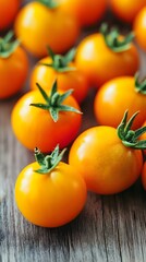 Closeup of Juicy Yellow Cherry Tomatoes on Wooden Surface