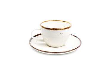 Side view, Beige ceramic coffee cup or tea and saucer with brown dots and rim isolated on a white background. Template for food design, and banner. Use for home or restaurant..