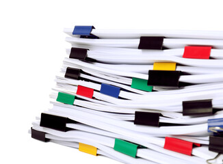Colorful binder clips with sheets of paper isolated on white