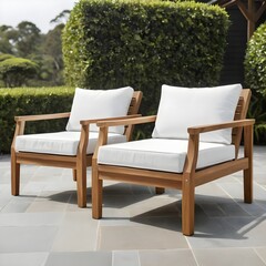Obraz premium Relaxing Outdoor Patio Chairs with White Cushions