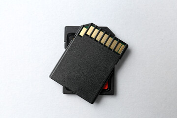 Two SD memory cards on white background, top view