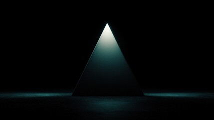 A triangular prism illuminated from above, casting a shadow on the floor below.