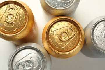 Different tin cans on white background, flat lay