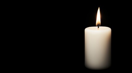 A single white candle with a flickering flame.