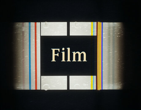 Aged Film Strip with Text and Grunge Effects