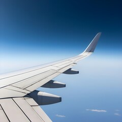 Obraz premium Airplane Wing Over Clouds